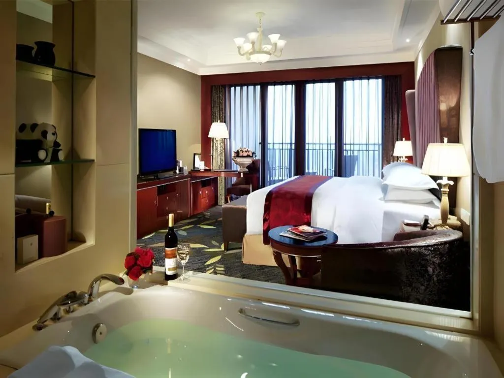 Bed in Xinjin Celebrity City Hotel