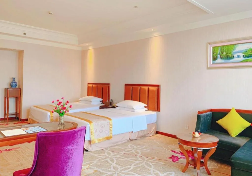 Bed in Xinjin Celebrity City Hotel