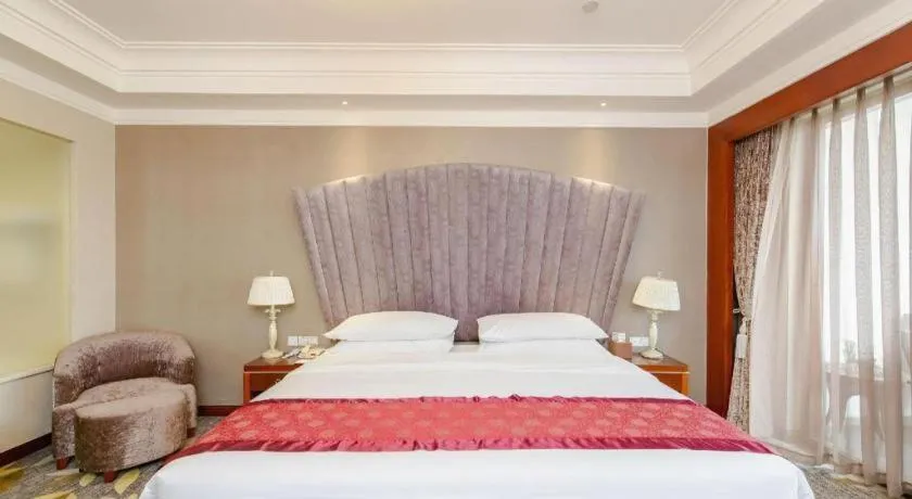 Bed in Xinjin Celebrity City Hotel