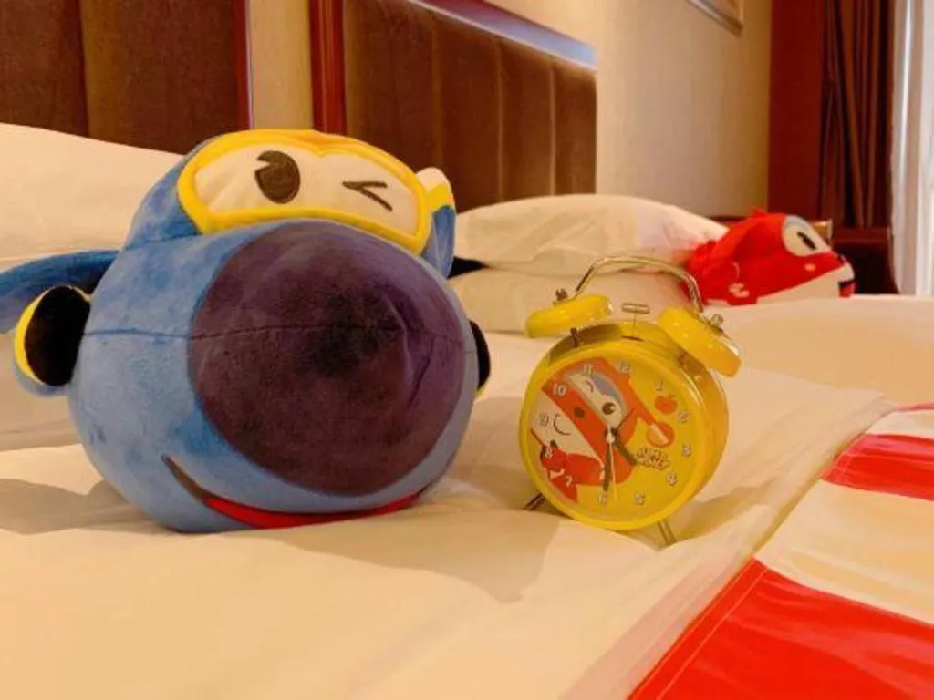 Bed in Xinjin Celebrity City Hotel