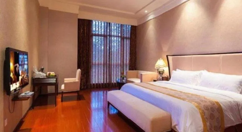 Bed in Xinjin Celebrity City Hotel