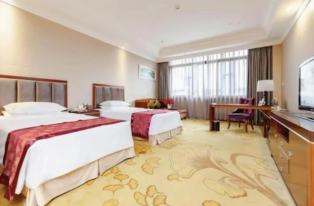 Bed in Xinjin Celebrity City Hotel