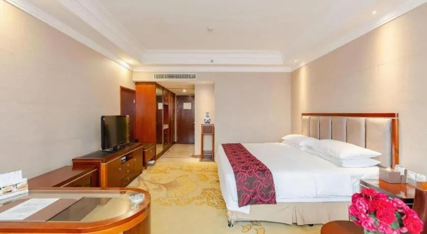 Bed in Xinjin Celebrity City Hotel