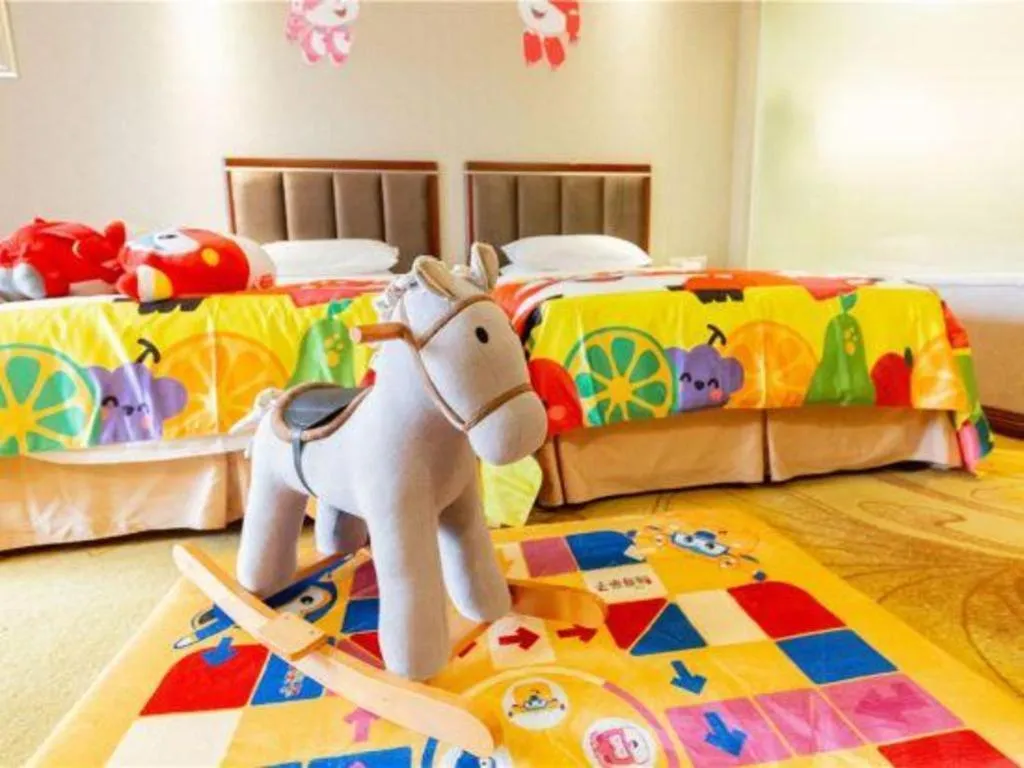 Bed in Xinjin Celebrity City Hotel