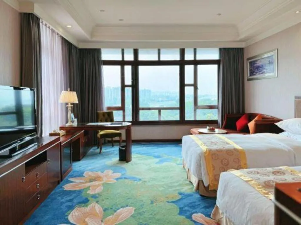 Bed in Xinjin Celebrity City Hotel