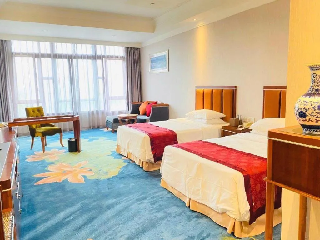 Bed in Xinjin Celebrity City Hotel