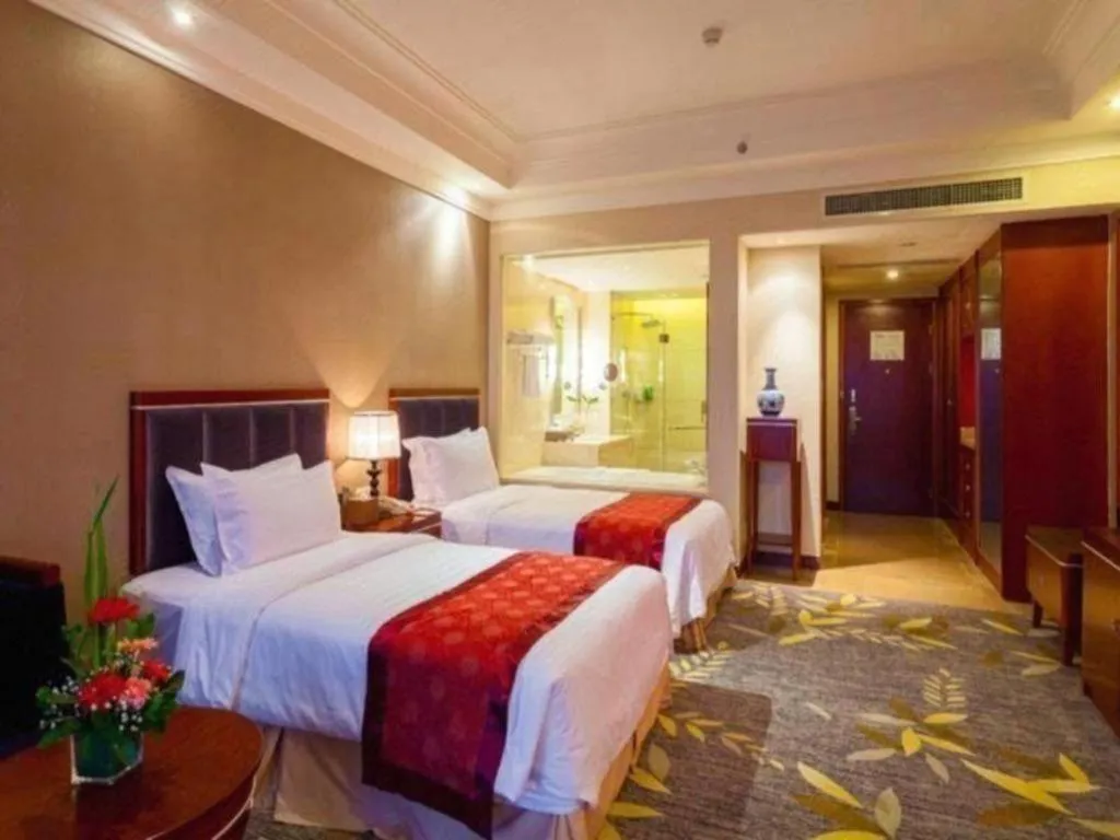 Bed in Xinjin Celebrity City Hotel