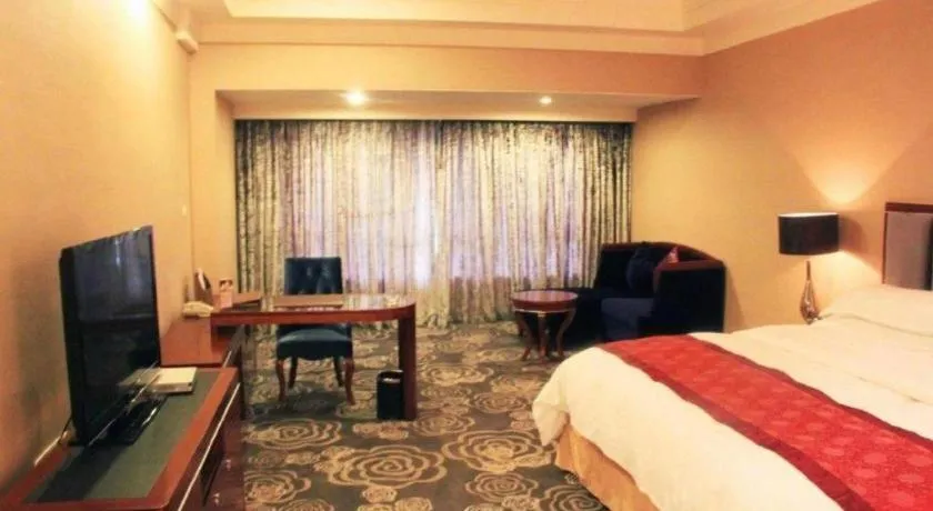 Bed in Xinjin Celebrity City Hotel