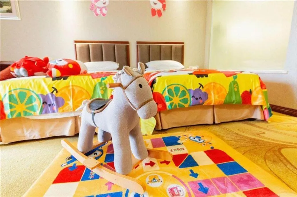 Bed in Xinjin Celebrity City Hotel