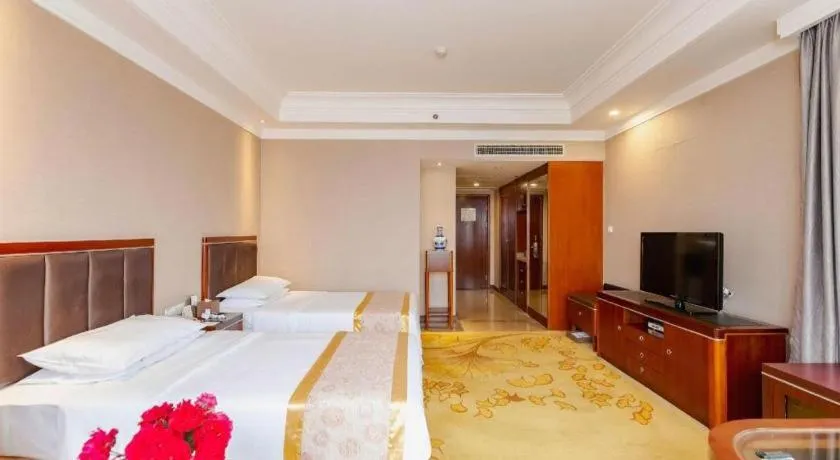 Bed in Xinjin Celebrity City Hotel