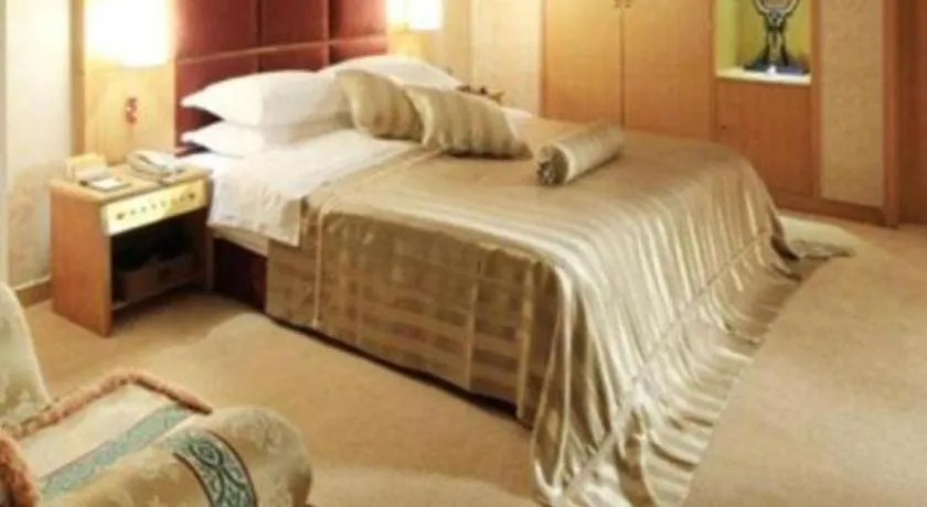 Bed in Economic Trade Hotel