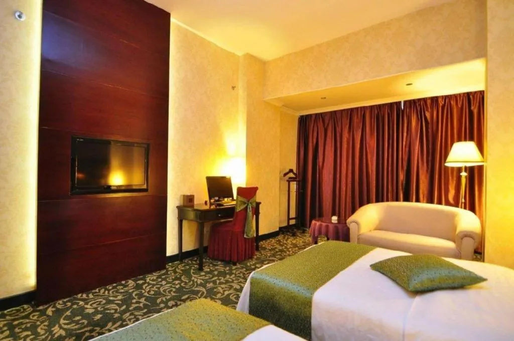 Bed in Economic Trade Hotel