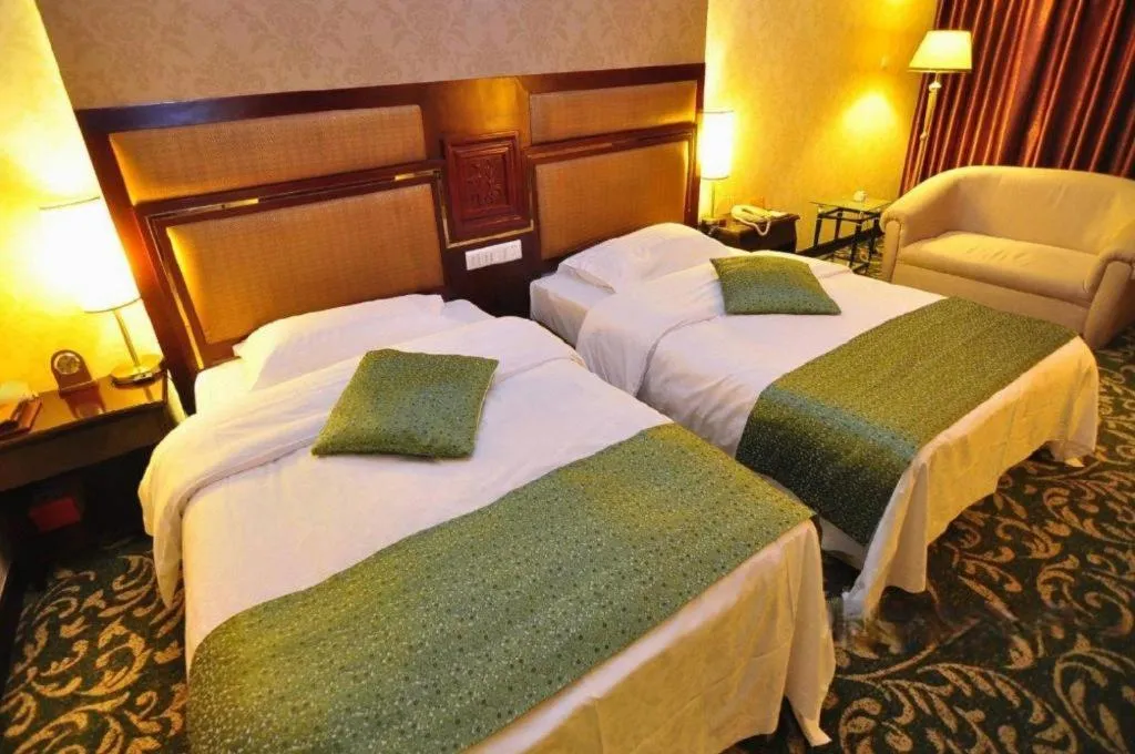 Bed in Economic Trade Hotel
