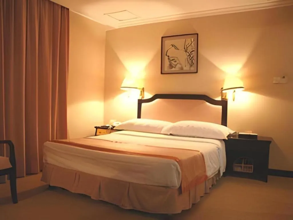 Bed in Economic Trade Hotel