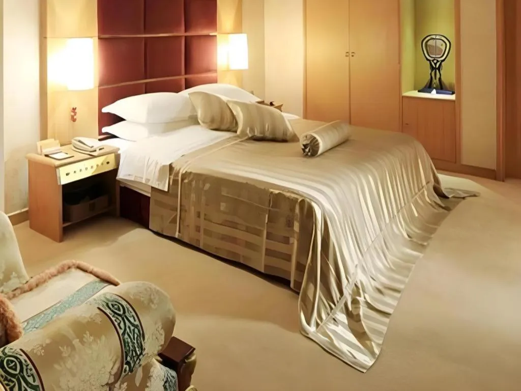 Bed in Economic Trade Hotel