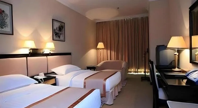 Bed in Economic Trade Hotel