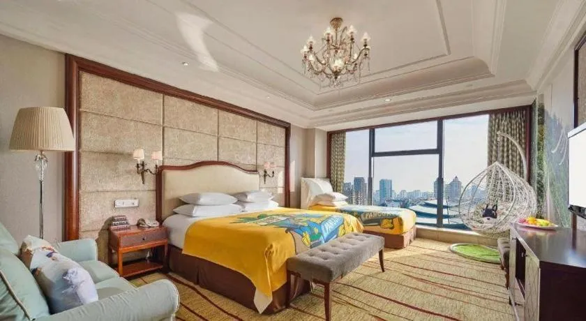 Bed in New Century Grand Hotel Zhejiang Sanli