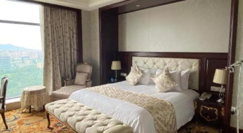 Bed in New Century Grand Hotel Zhejiang Sanli