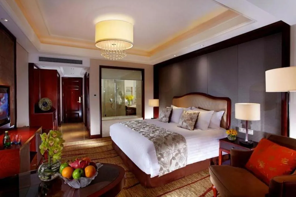 Bed in New Century Grand Hotel Zhejiang Sanli