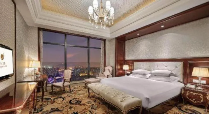 Bed in New Century Grand Hotel Zhejiang Sanli