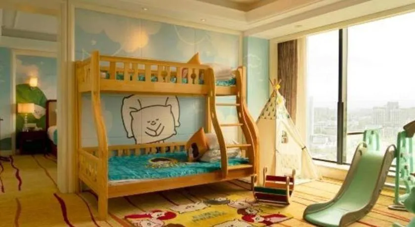 Bed in New Century Grand Hotel Zhejiang Sanli