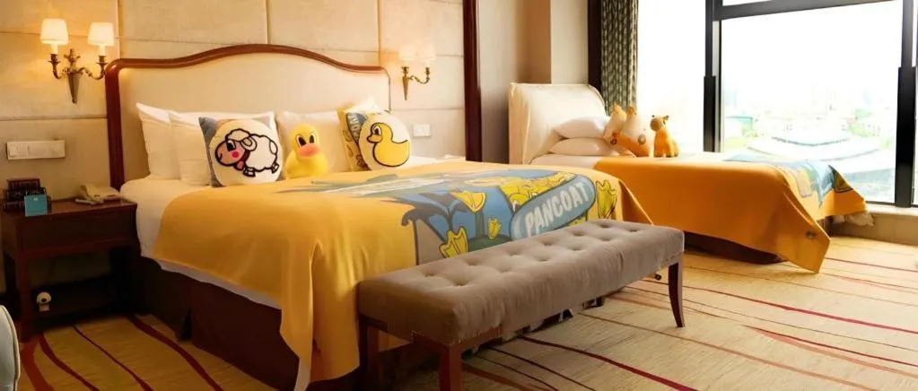 Bed in New Century Grand Hotel Zhejiang Sanli