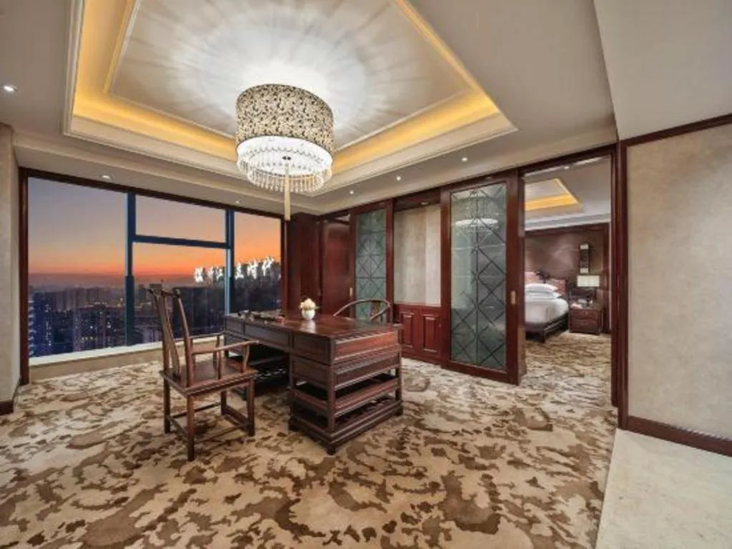 Bed in New Century Grand Hotel Zhejiang Sanli