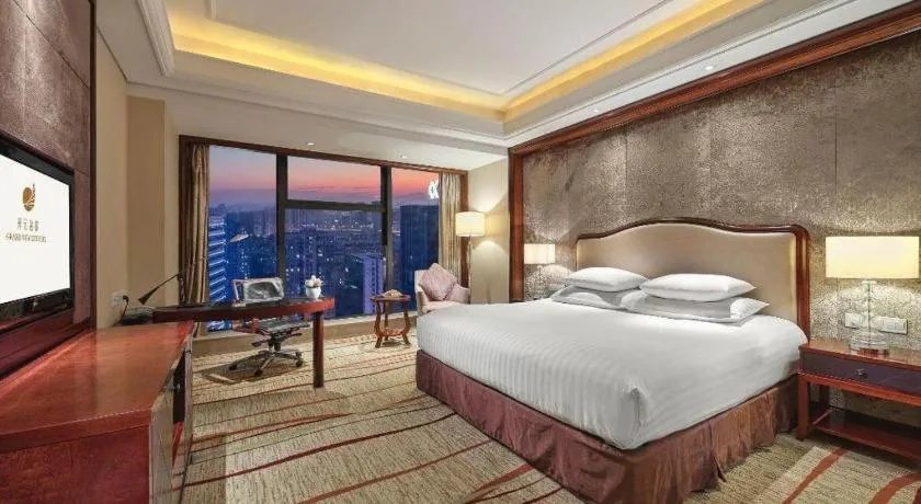 Bed in New Century Grand Hotel Zhejiang Sanli