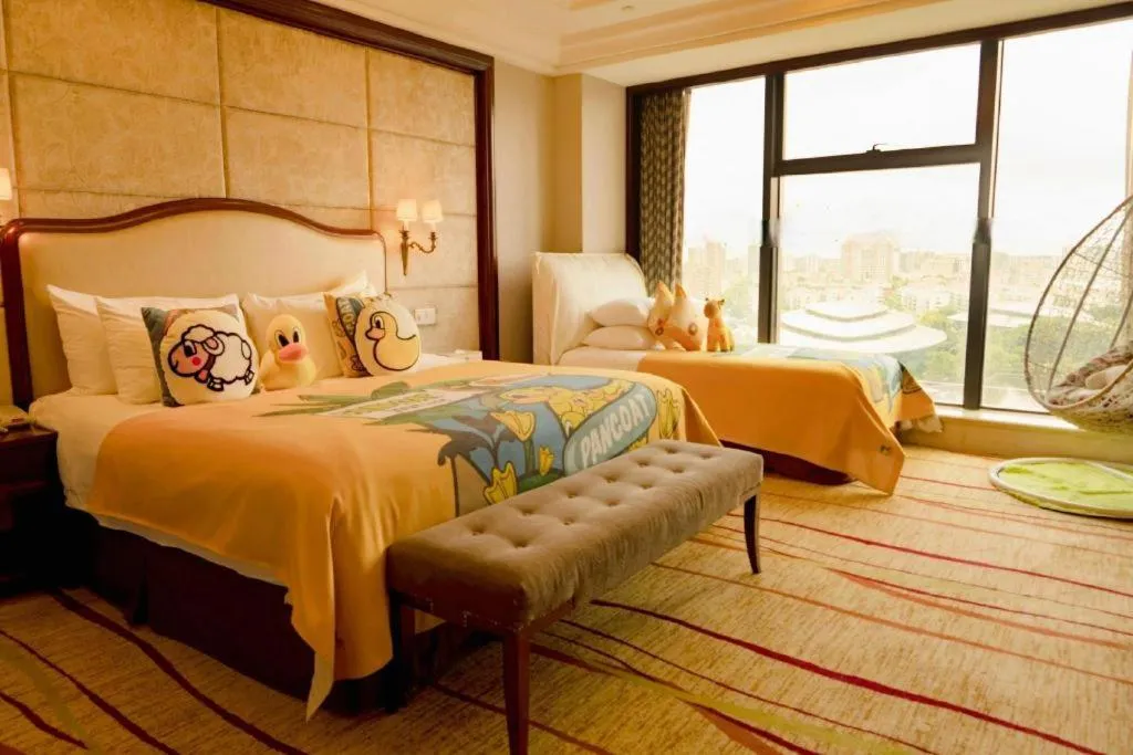 Bed in New Century Grand Hotel Zhejiang Sanli