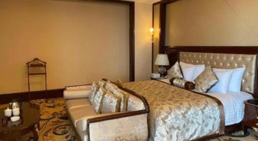Bed in New Century Grand Hotel Zhejiang Sanli