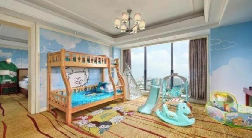 Bed in New Century Grand Hotel Zhejiang Sanli