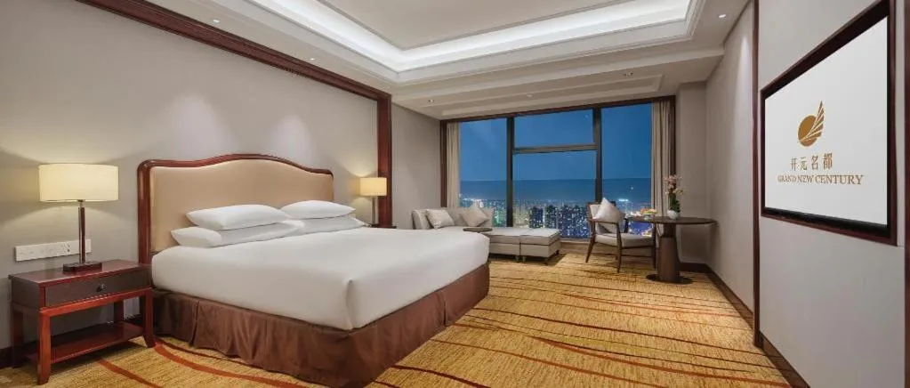 Bed in New Century Grand Hotel Zhejiang Sanli
