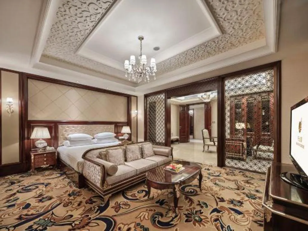 Bed in New Century Grand Hotel Zhejiang Sanli