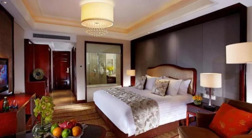 Bed in New Century Grand Hotel Zhejiang Sanli