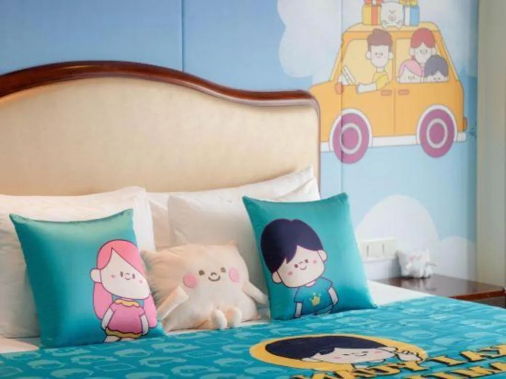 Bed in New Century Grand Hotel Zhejiang Sanli