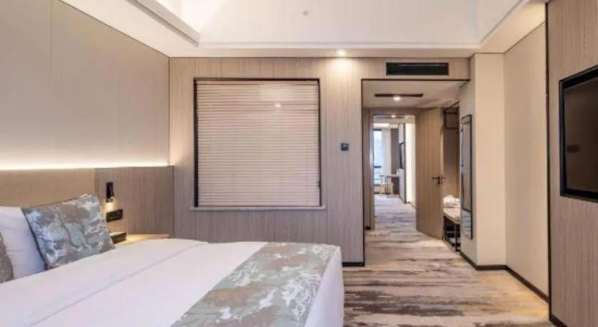 Bed in Jiaxing Fortune Holiday Hotel