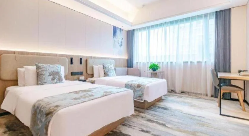 Bed in Jiaxing Fortune Holiday Hotel