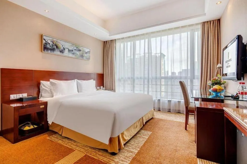Bed in Jiaxing Fortune Holiday Hotel