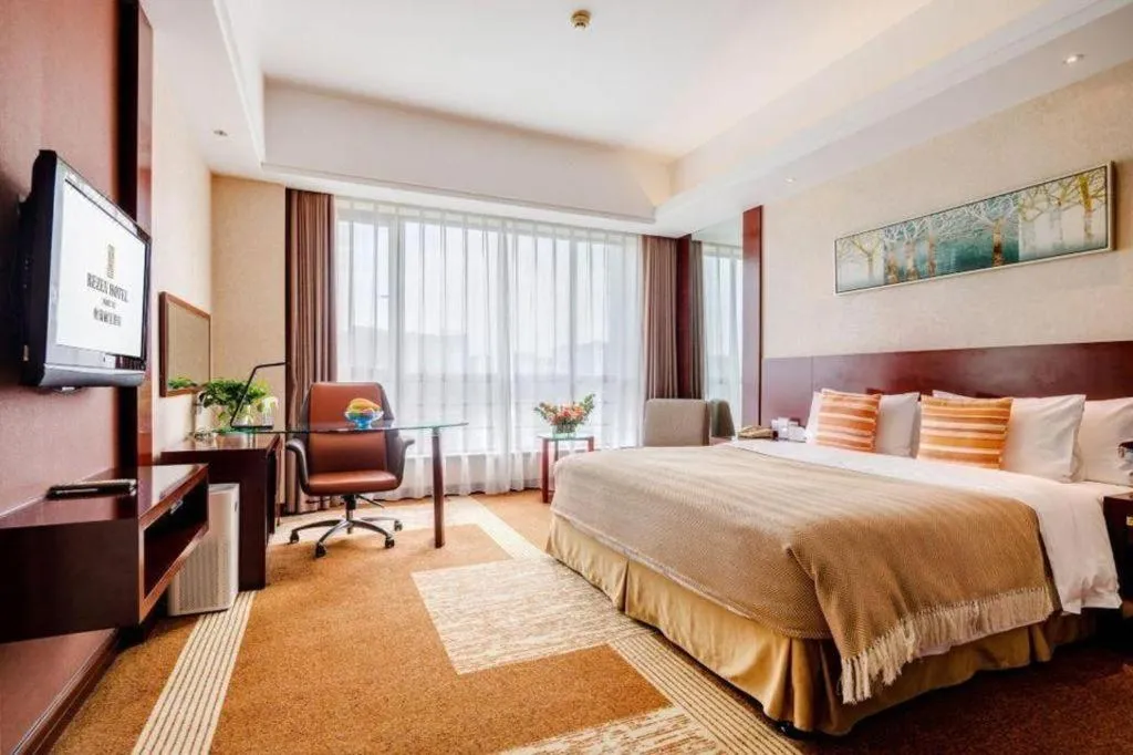 Bed in Jiaxing Fortune Holiday Hotel