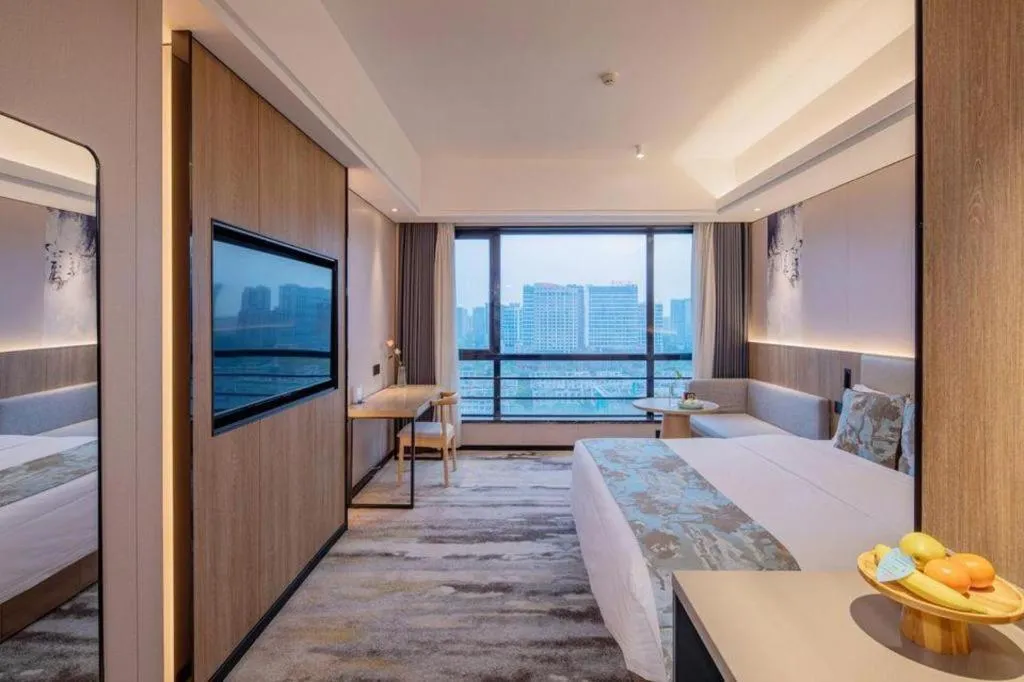 Bed in Jiaxing Fortune Holiday Hotel