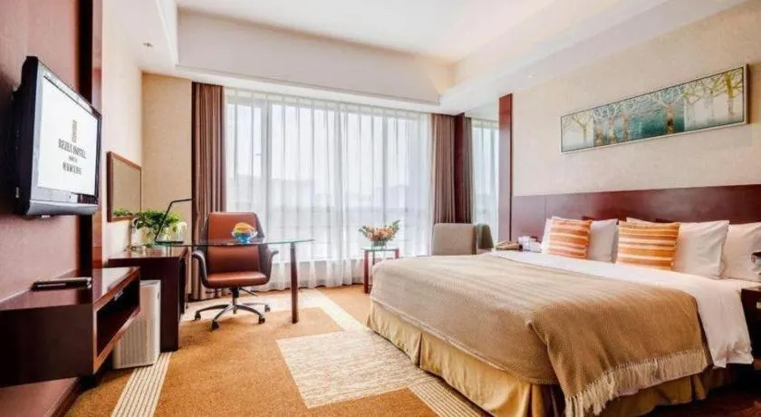 Bed in Jiaxing Fortune Holiday Hotel