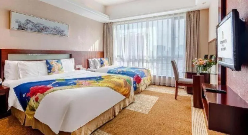 Bed in Jiaxing Fortune Holiday Hotel