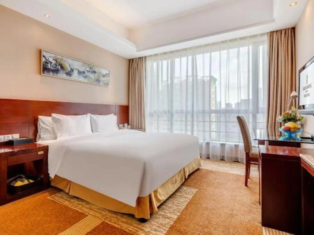 Bed in Jiaxing Fortune Holiday Hotel