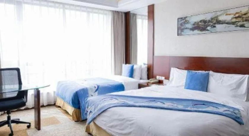 Bed in Jiaxing Fortune Holiday Hotel