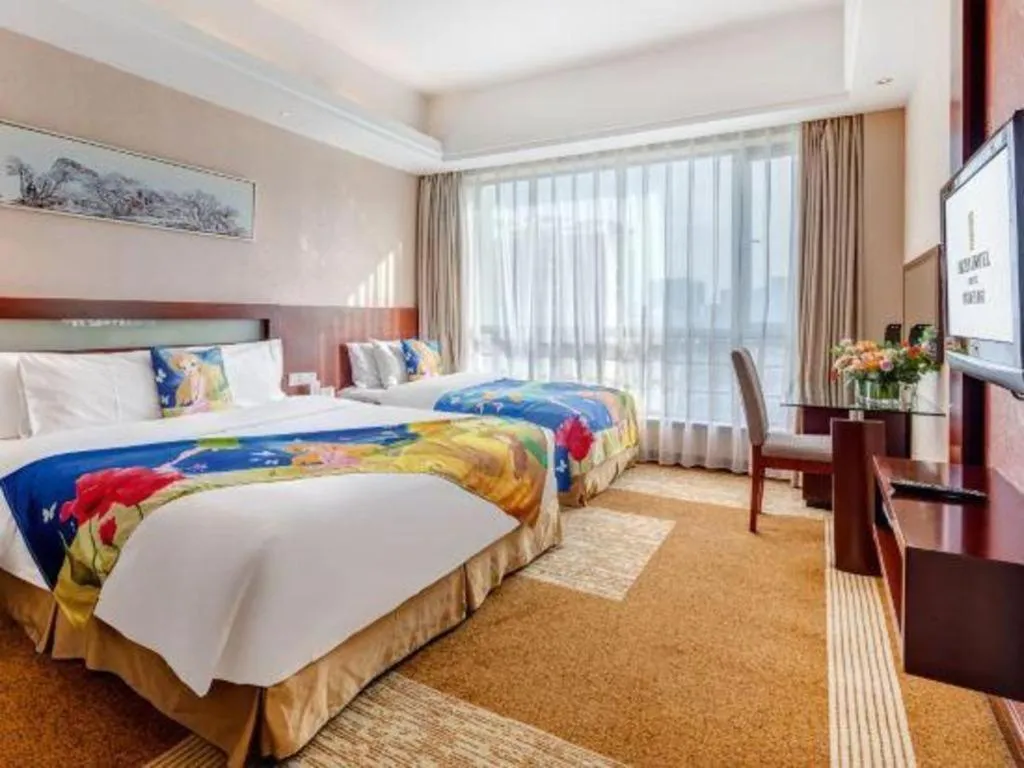 Bed in Jiaxing Fortune Holiday Hotel