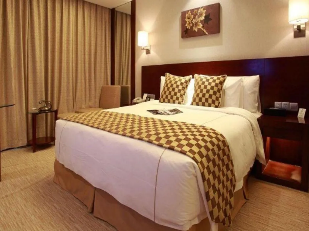 Bed in Jiaxing Fortune Holiday Hotel