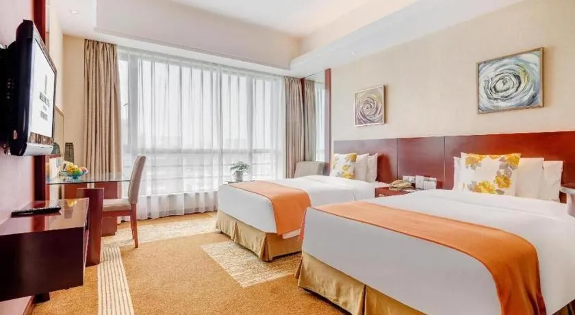 Bed in Jiaxing Fortune Holiday Hotel