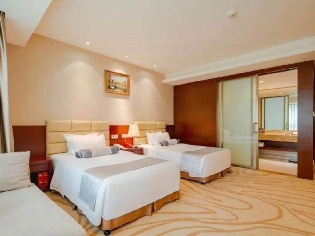 Bed in Chengdu Sovereign Hotel