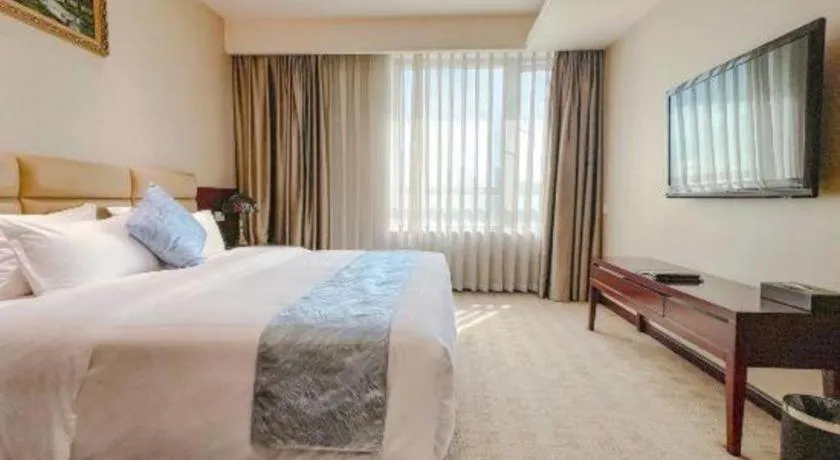 Bed in Chengdu Sovereign Hotel