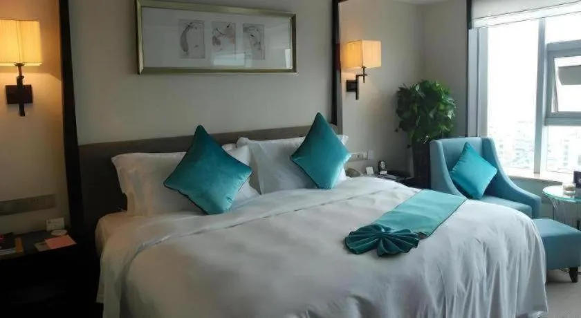 Bed in Fuyang International Trade Centre Hotel